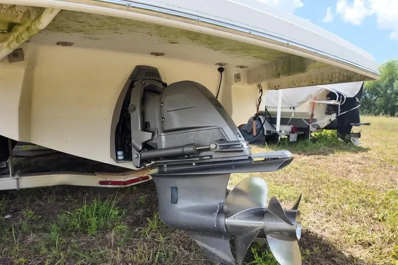 Slide: The Image of 2018 Regal 2300 Bowrider boat stern drive and propeller on grass. - 10