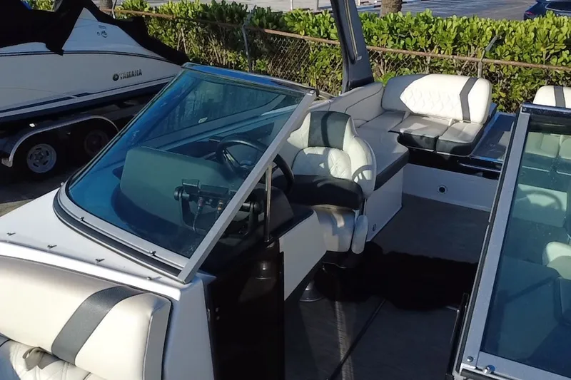 Slide: The Image of 2018 Regal 2300 Bowrider interior with sleek seating and modern dashboard design. - 22