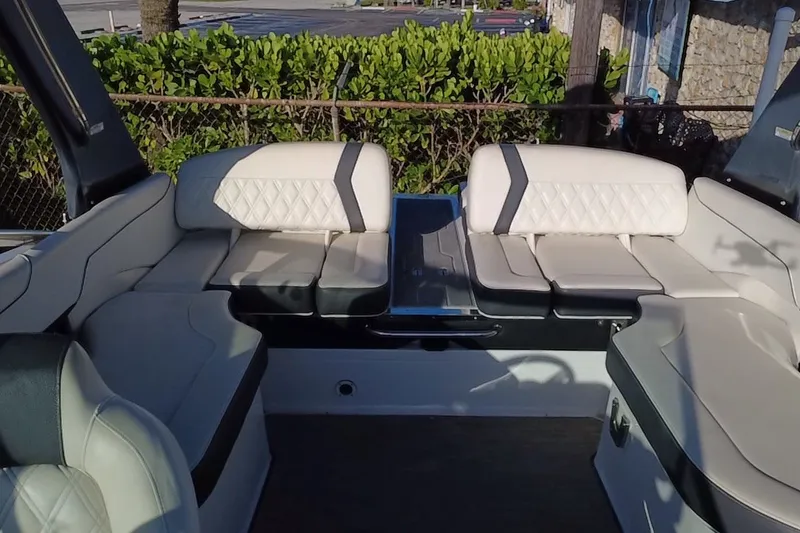 Slide: The Image of 2018 Regal 2300 Bowrider interior with luxurious white seating and elegant design. - 23