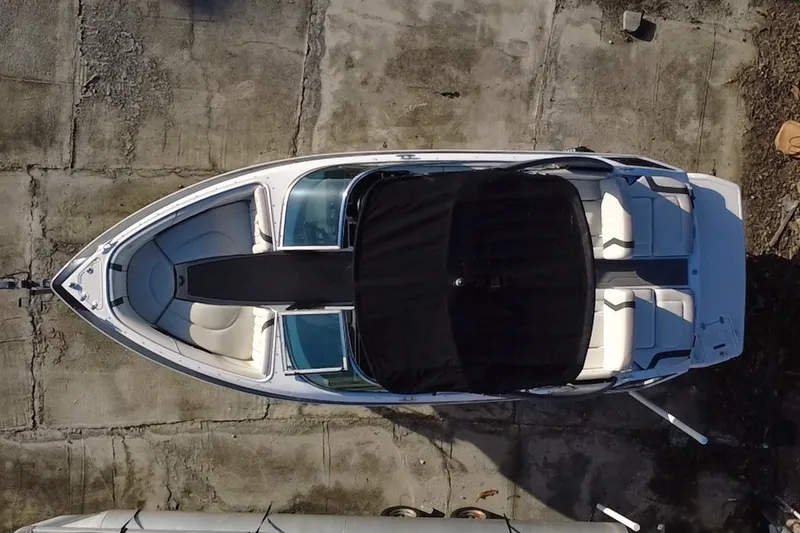 Slide: The Image of Overhead view of a 2018 Regal 2300 Bowrider boat on concrete surface. - 5