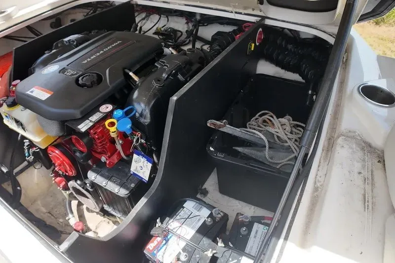 Slide: The Image of Engine compartment of a 2018 Regal 2300 Bowrider boat, featuring a Volvo Penta engine. - 26