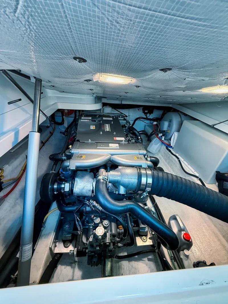Slide: The Image of Engine compartment of a 2016 Back Cove 30 with visible engine and wiring. - 26