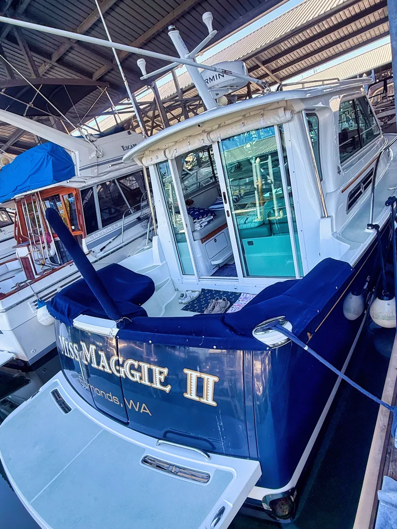 Slide: The Image of 2016 Back Cove 30 docked in a covered marina. - 27