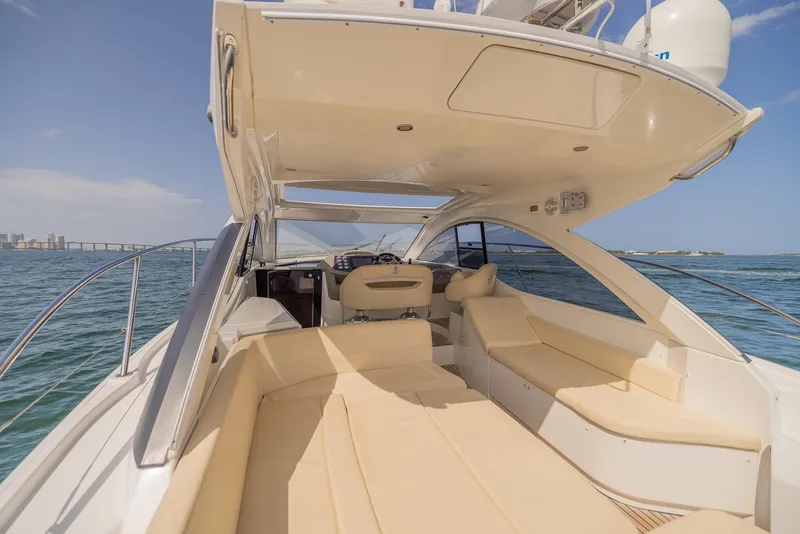 Slide: The Image of 2013 Beneteau Gran Turismo 38 yacht interior with spacious seating, cruising on open water. - 6