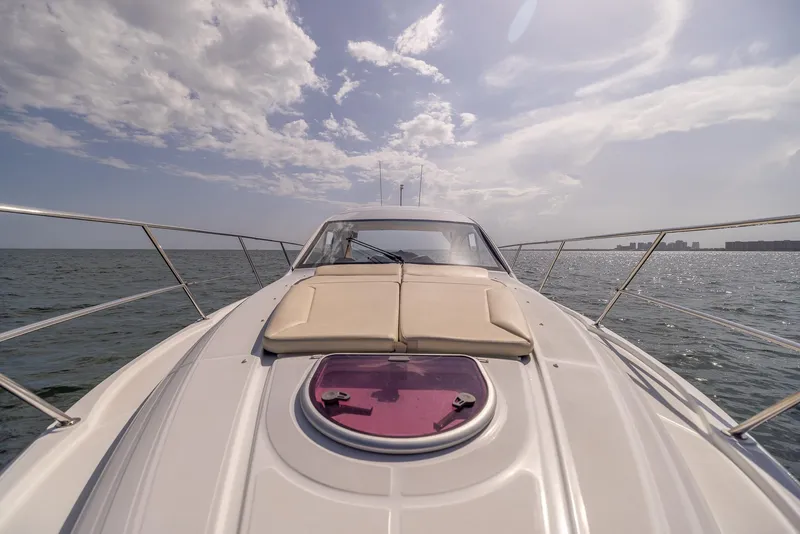 Slide: The Image of 2013 Beneteau Gran Turismo 38 yacht on open water under a partly cloudy sky. - 21