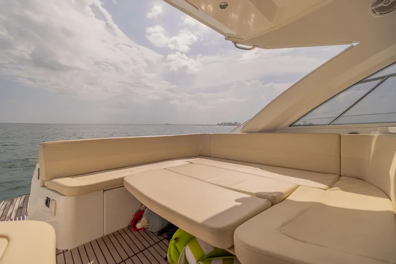 Slide: The Image of Luxurious seating area on 2013 Beneteau GRAN TURISMO 38 yacht, overlooking the ocean. - 8