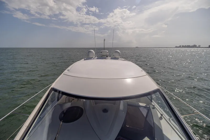 Slide: The Image of 2013 Beneteau Gran Turismo 38 yacht cruising on open water under a cloudy sky. - 15