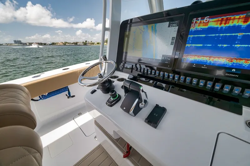 Slide: The Image of Helm of 2026 Freeman 42LR boat with advanced navigation displays and controls. - 112