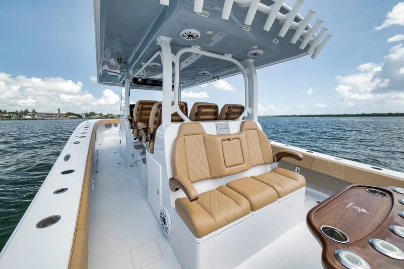 Slide: The Image of Luxurious 2026 Freeman 42LR boat interior with tan seating, sleek design, and ocean backdrop. - 89