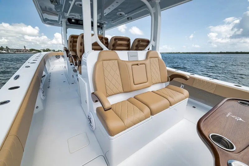Slide: The Image of Luxurious interior of 2026 Freeman 42LR boat with tan seating and ocean view. - 88