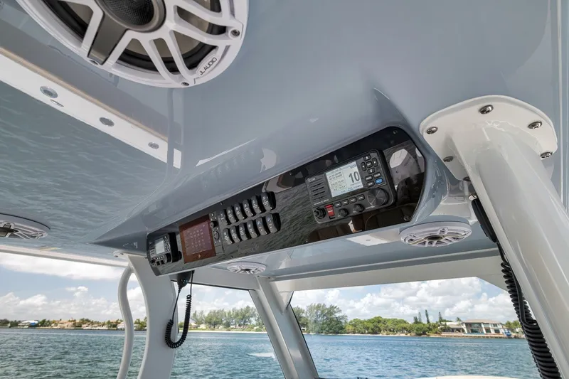 Slide: The Image of Interior view of 2026 Freeman 42LR boat's control panel with speakers and navigation equipment. - 109