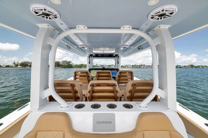 Slide: The Image of Interior view of 2026 Freeman 42LR boat with seating and Garmin equipment. - 93