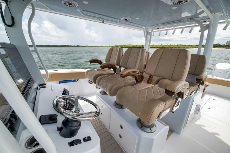 Slide: The Image of Luxurious interior of 2026 Freeman 42LR boat with plush seating and modern controls. - 101