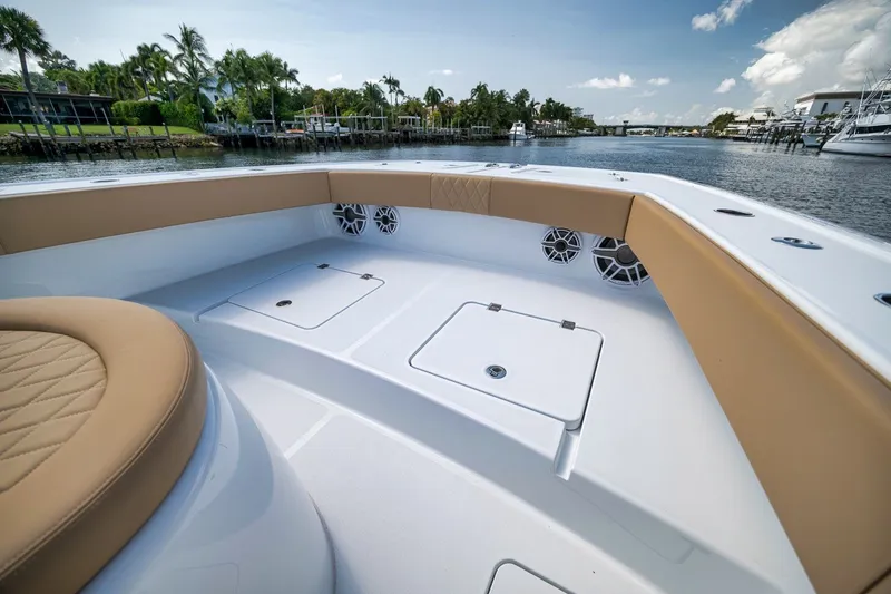 Slide: The Image of Luxurious Freeman 42LR boat interior, 2026 model, with tan seating and waterfront view. - 40