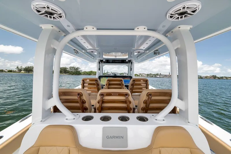 Slide: The Image of Interior view of 2026 Freeman 42LR boat with seating and Garmin equipment. - 92