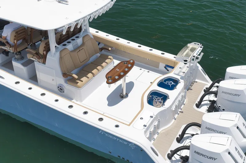 Slide: The Image of Luxurious 2026 Freeman 42LR boat with spacious seating and powerful Mercury engines. - 26