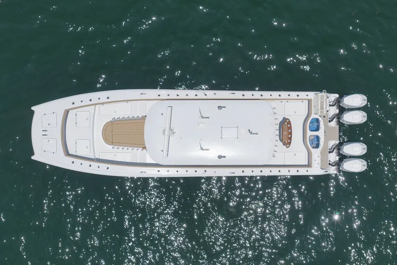 Slide: The Image of Aerial view of 2026 Freeman 42LR boat on sparkling water. - 33
