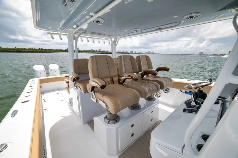 Slide: The Image of Luxurious seating on 2026 Freeman 42LR boat with scenic ocean view. - 111