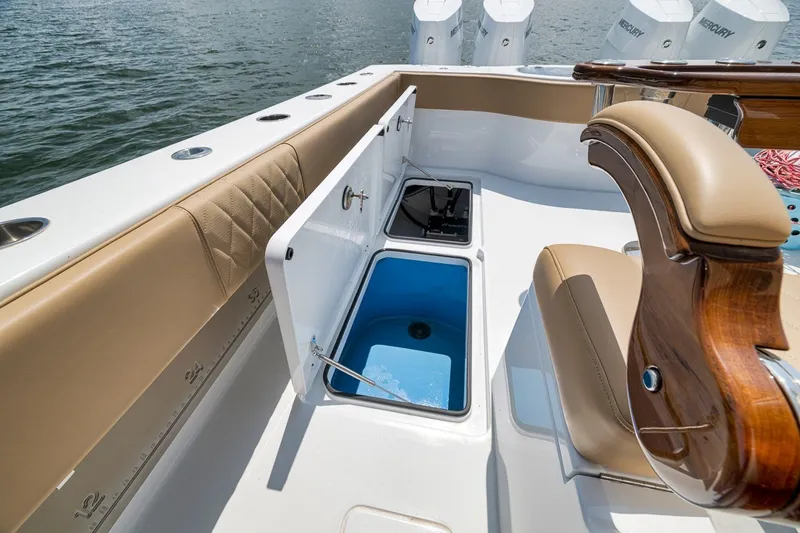 Slide: The Image of Freeman 42LR 2026 boat interior with open storage compartment and seating. - 66