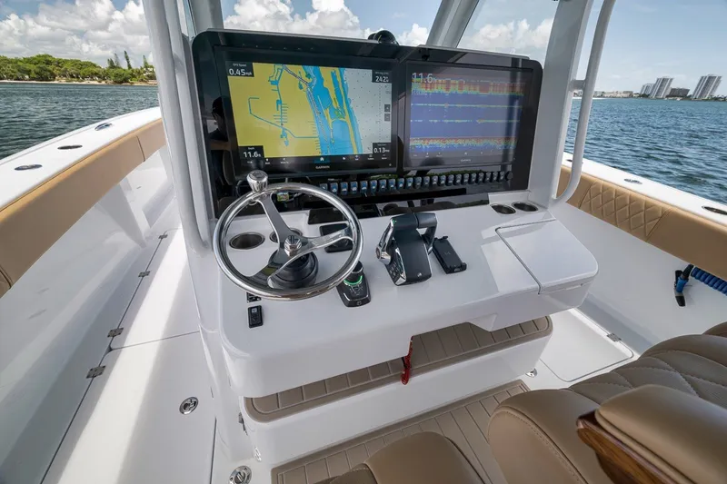 Slide: The Image of Helm of 2026 Freeman 42LR boat with advanced navigation displays and controls. - 114