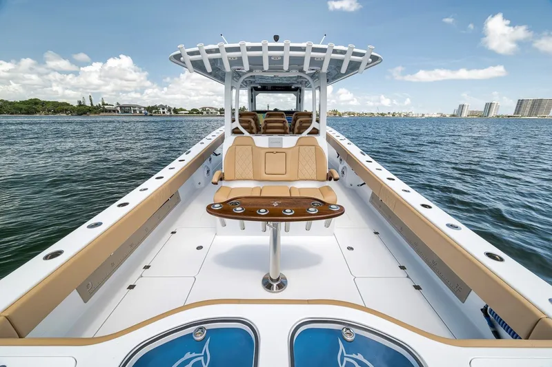 Slide: The Image of 2026 Freeman 42LR boat on water, featuring spacious deck and luxurious seating. - 85