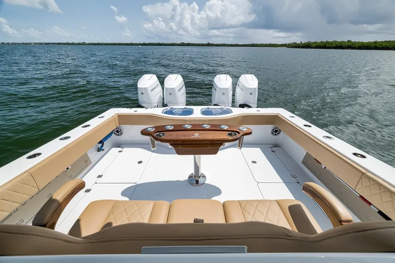 Slide: The Image of Luxurious 2026 Freeman 42LR boat interior with quad engines on a serene water backdrop. - 73