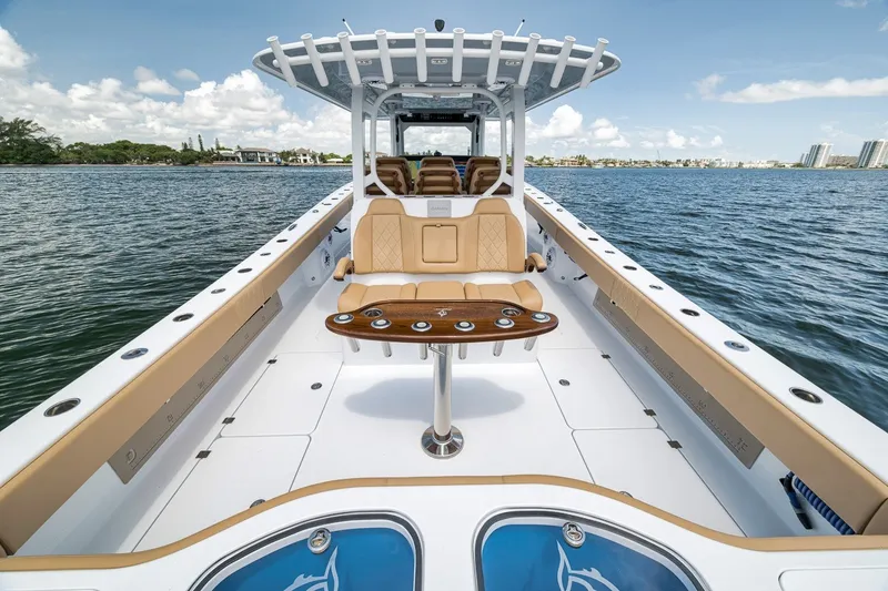 Slide: The Image of 2026 Freeman 42LR boat on water, featuring spacious deck and luxurious seating. - 84