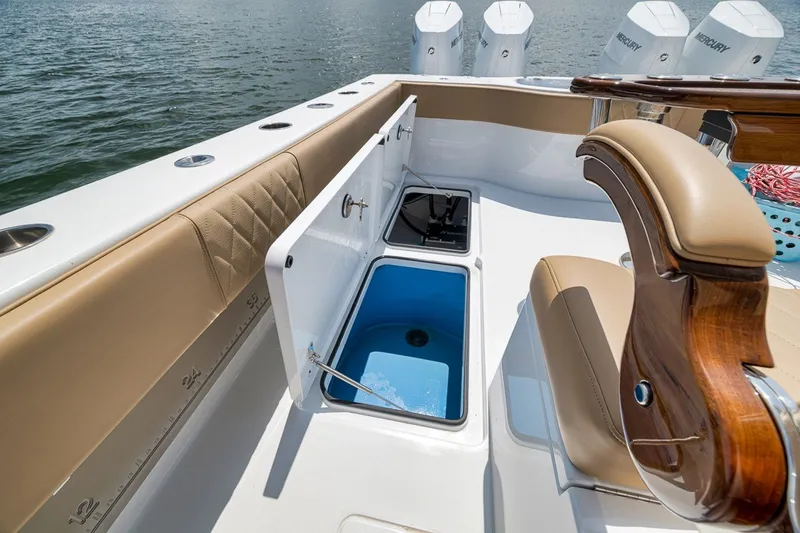 Slide: The Image of Luxurious 2026 Freeman 42LR boat interior with seating, storage, and Mercury engines. - 65