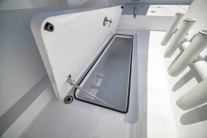 Slide: The Image of Open storage compartment on a 2026 Freeman 42LR boat, showcasing interior space. - 43