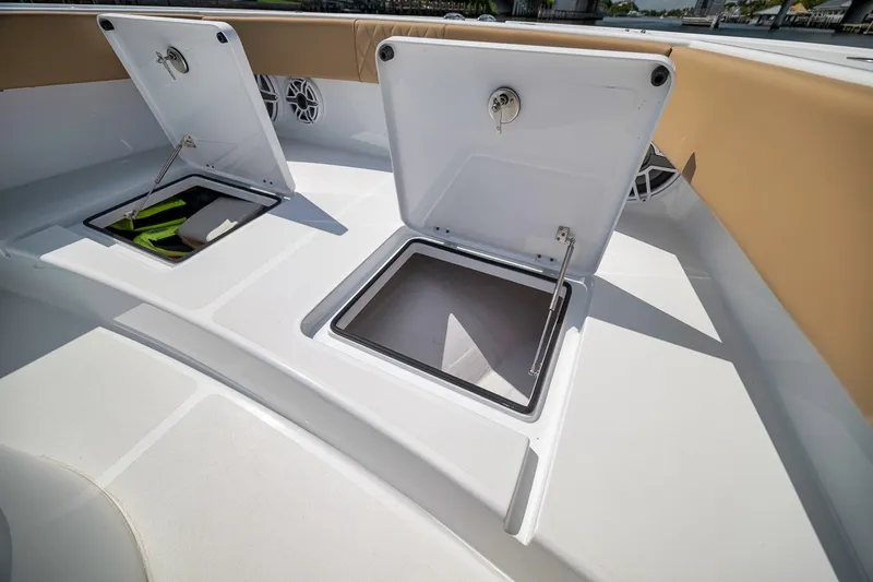 Slide: The Image of Open storage compartments on a 2026 Freeman 42LR boat deck. - 41