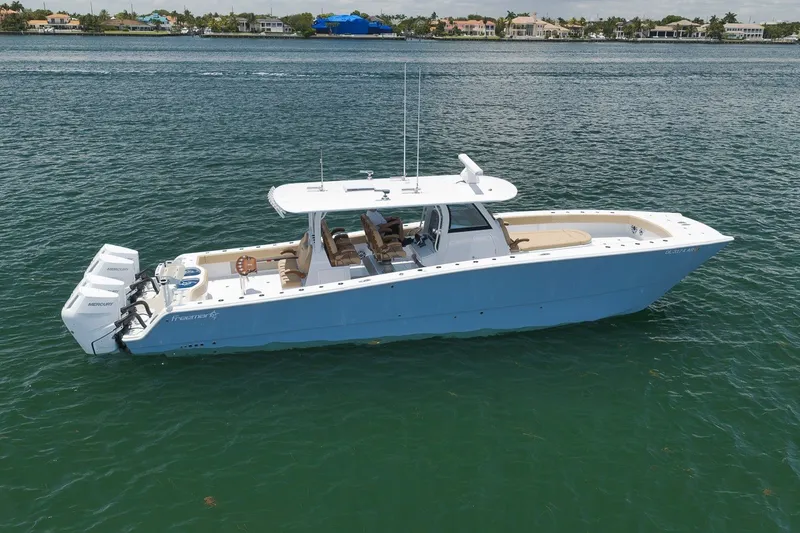 Slide: The Image of 2026 Freeman 42LR boat with triple Mercury engines on calm water. - 20