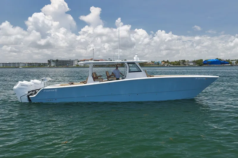 Slide: The Image of 2026 Freeman 42LR boat on water, clear sky, powerful Mercury engines. - 23