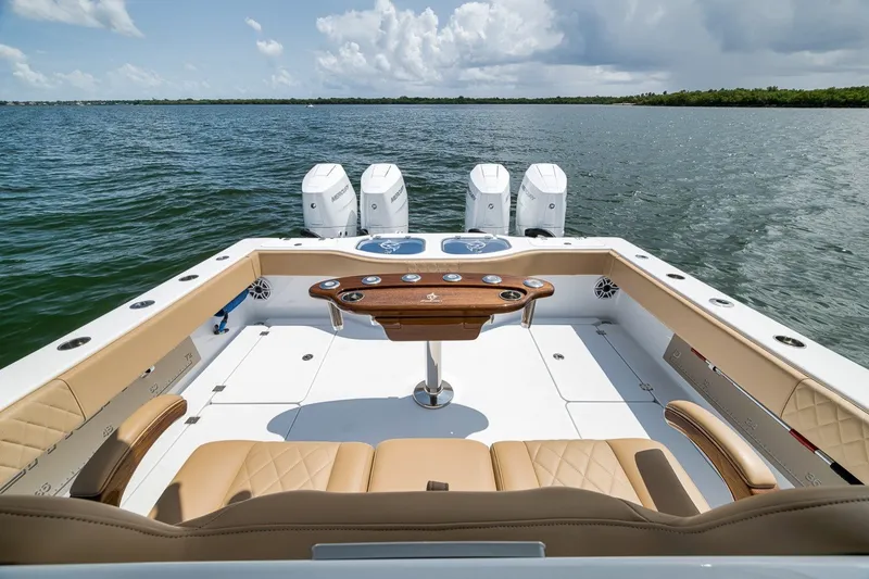 Slide: The Image of Luxurious 2026 Freeman 42LR boat interior with quad engines on open water. - 74