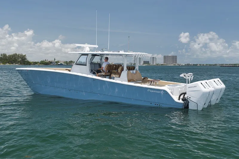 Slide: The Image of 2026 Freeman 42LR boat on water, featuring sleek design and powerful engines. - 30