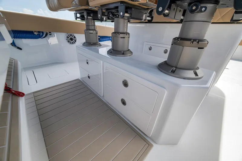 Slide: The Image of Interior view of a 2026 Freeman 42LR boat, featuring storage compartments and seating. - 82