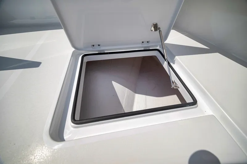 Slide: The Image of Open hatch on Freeman 42LR boat, showcasing interior storage space, 2026 model. - 42