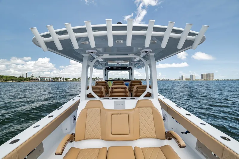 Slide: The Image of Luxury Freeman 42LR boat interior, 2026 model, on open water with clear skies. - 90