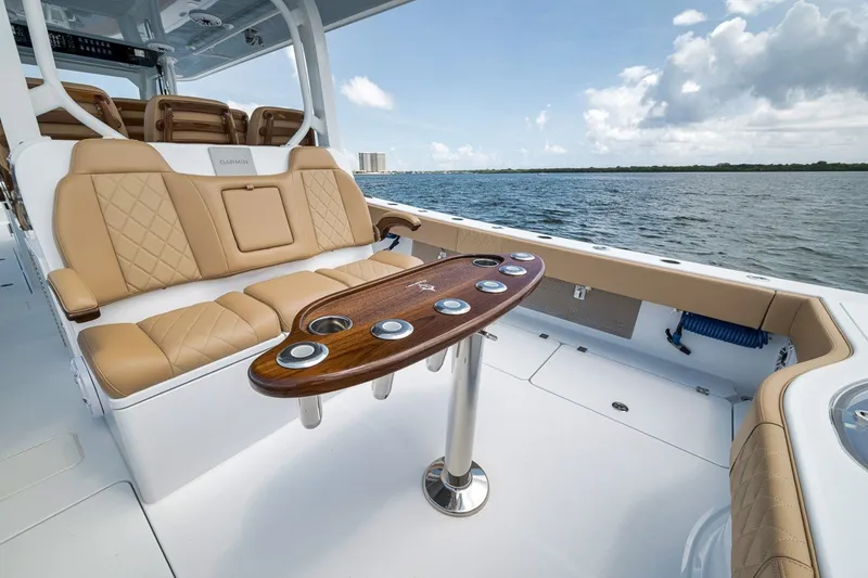 Slide: The Image of Luxurious seating and table on a 2026 Freeman 42LR boat, with ocean view. - 86