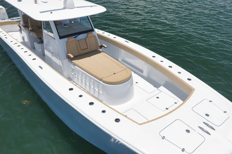 Slide: The Image of 2026 Freeman 42LR boat with sleek design, spacious deck, and luxurious seating on the water. - 19