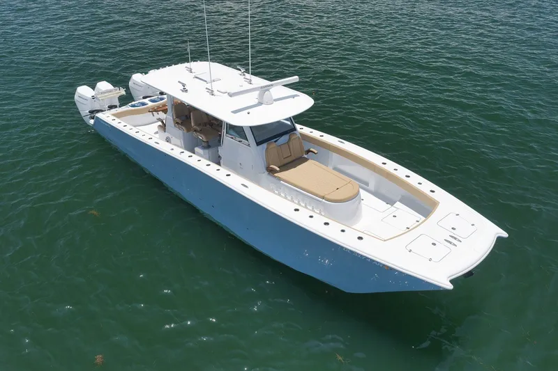 Slide: The Image of 2026 Freeman 42LR boat on water, featuring sleek design and dual outboard engines. - 18
