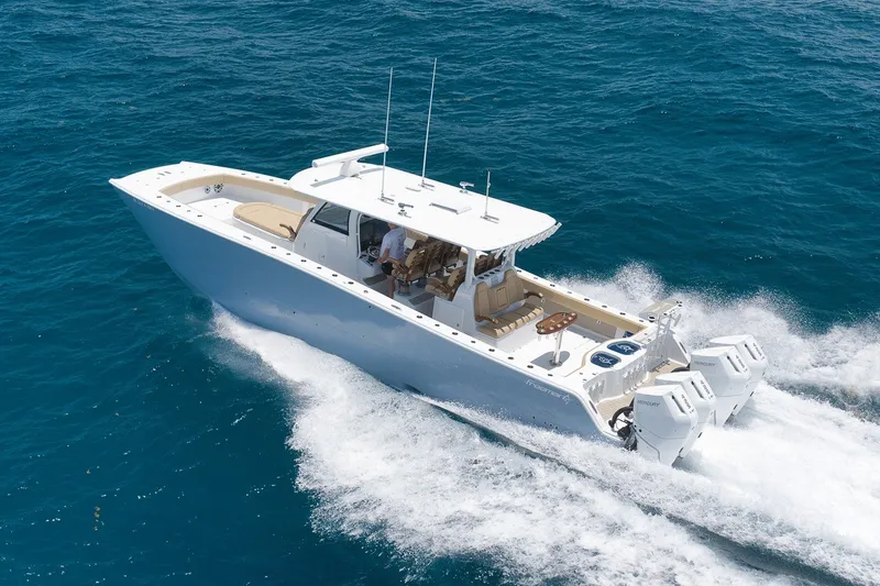 Slide: The Image of 2026 Freeman 42LR boat cruising on open blue ocean waters. - 17