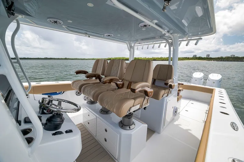 Slide: The Image of Luxurious interior of 2026 Freeman 42LR boat with plush seating and modern helm. - 100