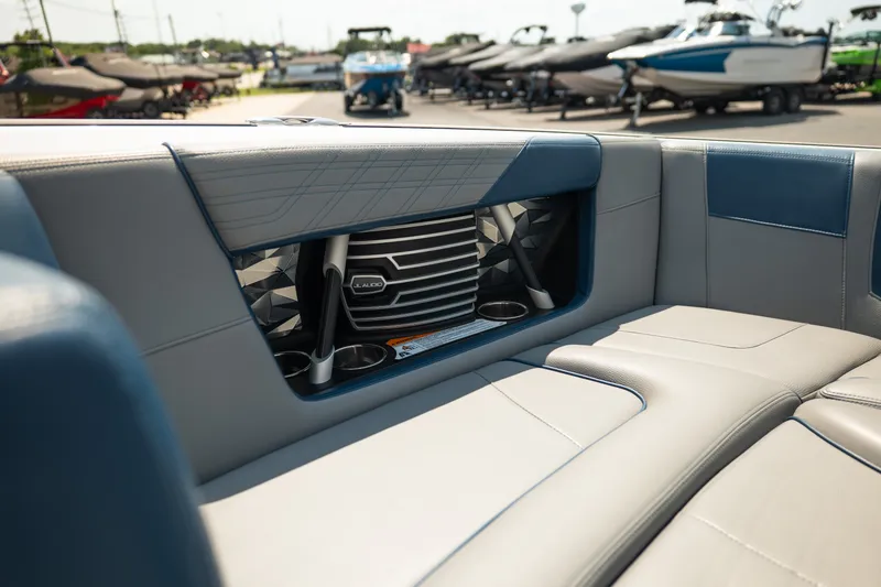 Slide: The Image of 2019 Nautique Super Air Nautique G23 interior with JL Audio speakers and cup holders. - 44