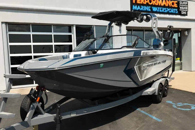 Slide: The Image of 2019 Nautique Super Air Nautique G23 boat on trailer outside marine dealership. - 15