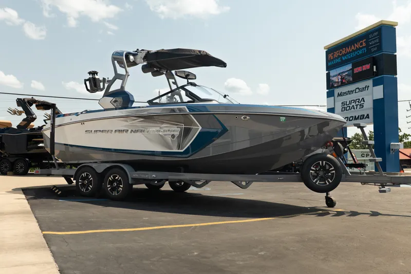 Slide: The Image of 2019 Nautique Super Air Nautique G23 boat on trailer at marine dealership. - 11