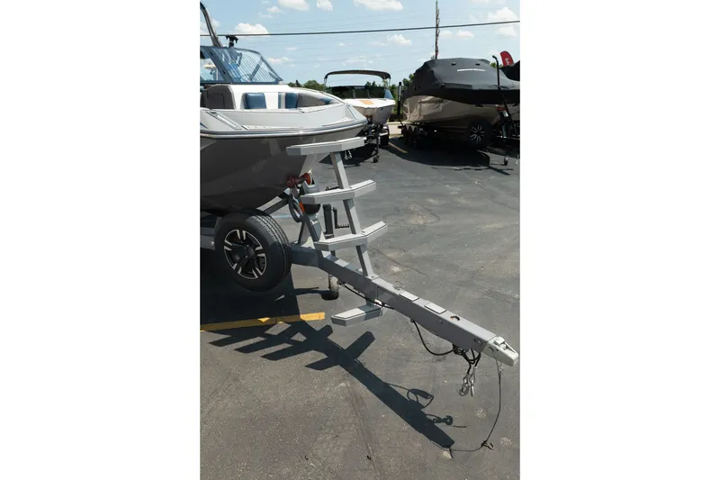 Slide: The Image of 2019 Nautique Super Air Nautique G23 boat on trailer in parking lot. - 13