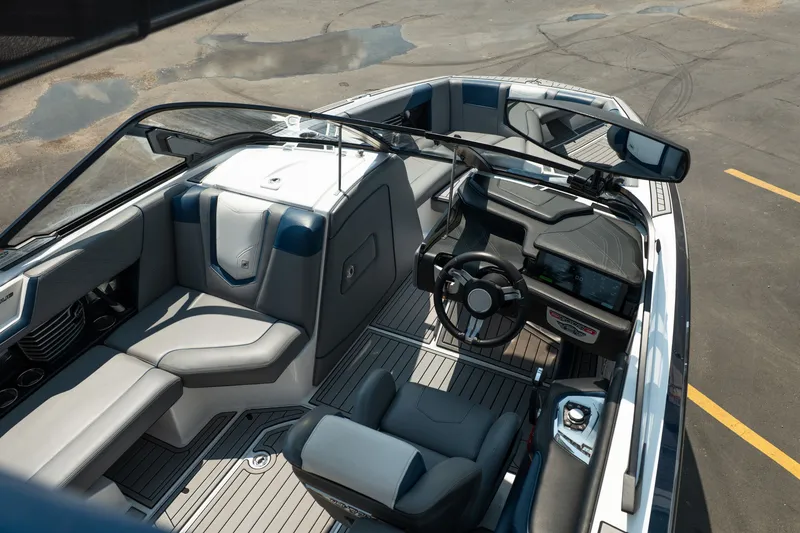 Slide: The Image of 2019 Nautique Super Air Nautique G23 boat interior with sleek design and modern dashboard. - 18