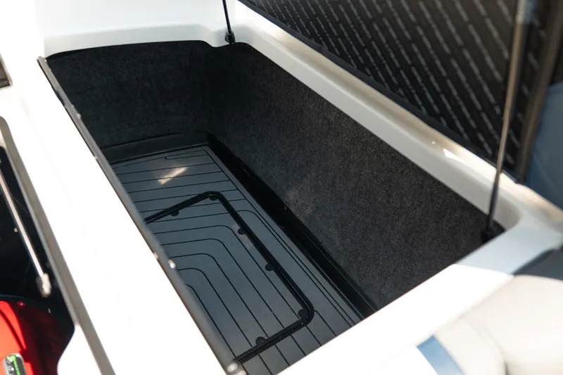 Slide: The Image of Open storage compartment in 2019 Nautique Super Air Nautique G23 boat. - 29