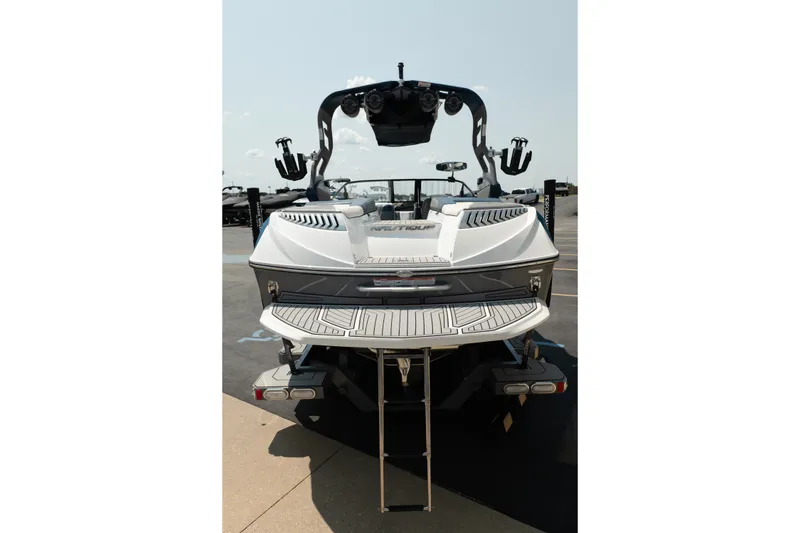 Slide: The Image of 2019 Nautique Super Air Nautique G23 boat, rear view with swim platform and tower. - 10