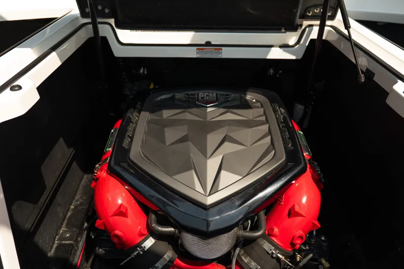 Slide: The Image of 2019 Nautique Super Air Nautique G23 engine compartment with PCM engine cover. - 27